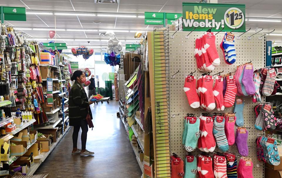 A woman shops at the Dollar Tree store where $1.25 price tags are now posted on the shelves, in Alhambra, California, December 10, 2021. - The store is known for its $1 items, but this week, due to inflation, prices to $1.25. US consumer prices rose last month at a rate not seen in nearly 40 years, the government reported Friday, underscoring how inflation threatens the world's largest economy and President Joe Biden's public support. (Photo by Frederic J. BROWN / AFP) (Photo by FREDERIC J. BROWN/AFP via Getty Images)