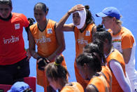 Members of the India women's field hockey team cool off during a training session at Oi Hockey Stadium ahead of the the 2020 Summer Olympics, Thursday, July 22, 2021, in Tokyo, Japan. (AP Photo/John Locher)