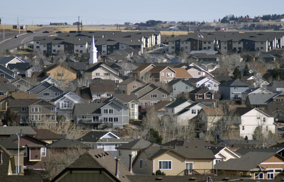 The steeple of a Mormon church rises above a neighborhood in Colorado Springs, Colo., on Wednesday, Nov. 23, 2022. The city is a place full of art shops and breweries; megachurches and military bases; a liberal arts college and the Air Force Academy. For years it's marketed itself as an outdoorsy boomtown with a population set to top Denver's by 2050. (AP Photo/Thomas Peipert)