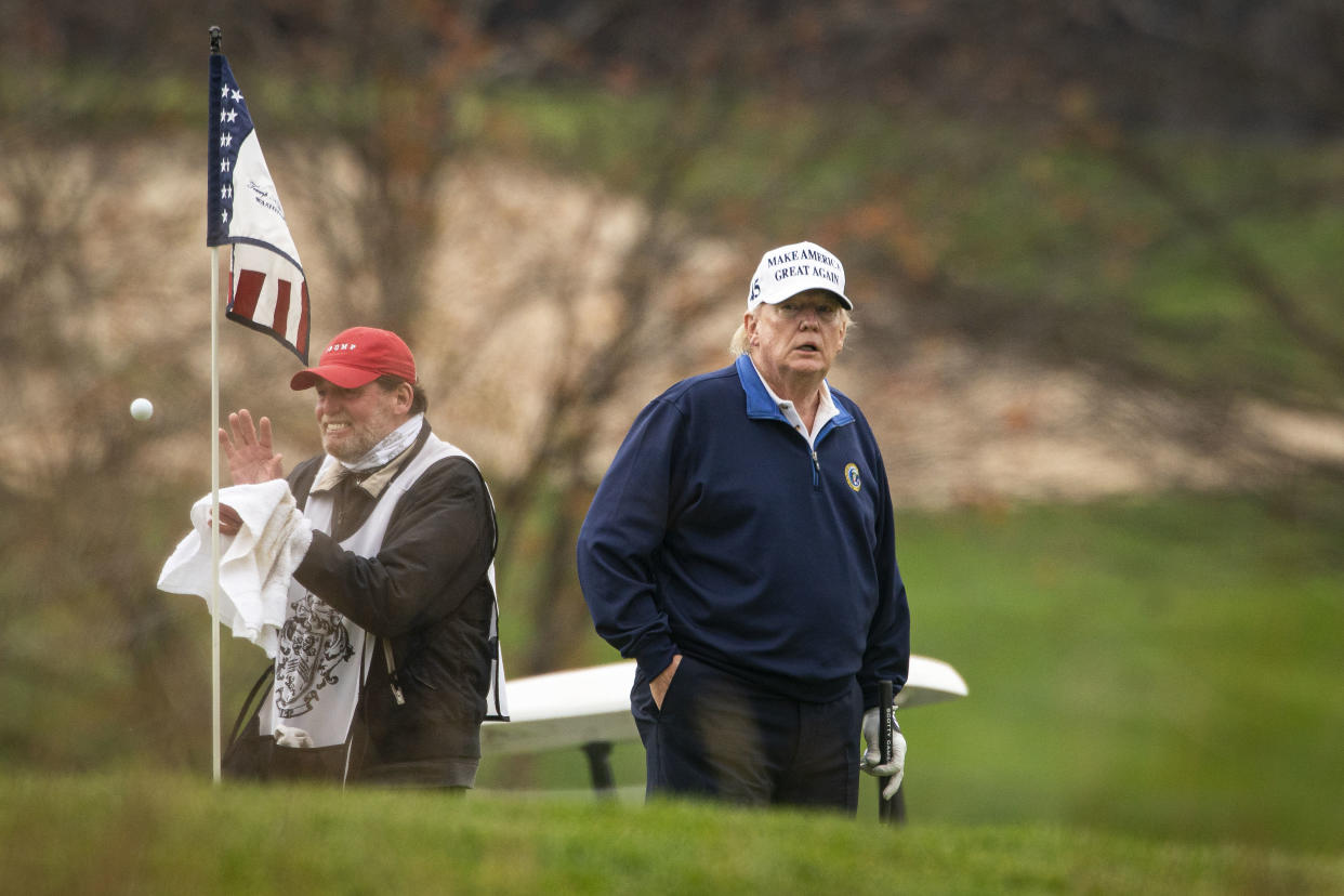 President Trump golfs at Trump National Golf Club in Sterling, Va., on Sunday. (Al Drago/The Washington Post via Getty Images)