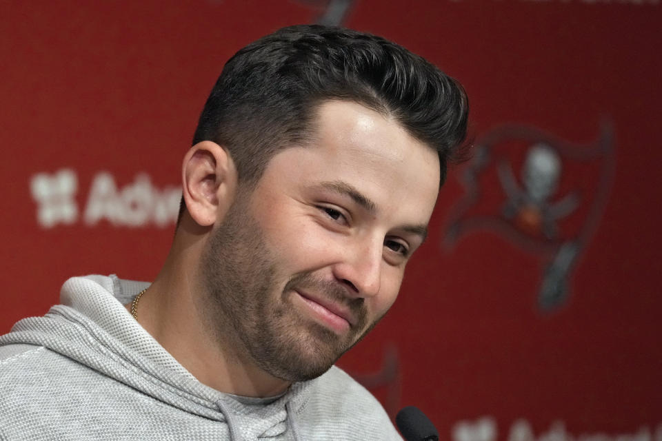 New Tampa Bay Buccaneers quarterback Baker Mayfield smiles as he listens to a question during an NFL football news conference on Monday, March 20, 2023, in Tampa, Fla. The Buccaneers signed Mayfield to a one year contract. (AP Photo/Chris O'Meara)