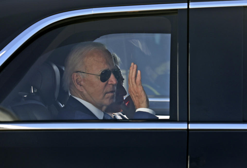 U.S. President Joe Biden waves as he leaves Israel's Ben Gurion Airport near Tel Aviv on his way to Jerusalem, Wednesday, July 13, 2022. (Gil Cohen-Magen/Pool via AP)