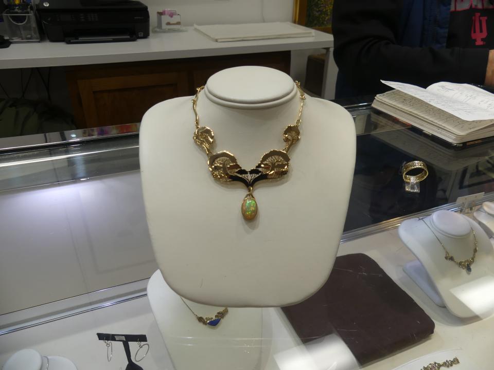 This 14-karat gold necklace at By Hand Gallery has a handmade chain and an Ethiopian opal stone.