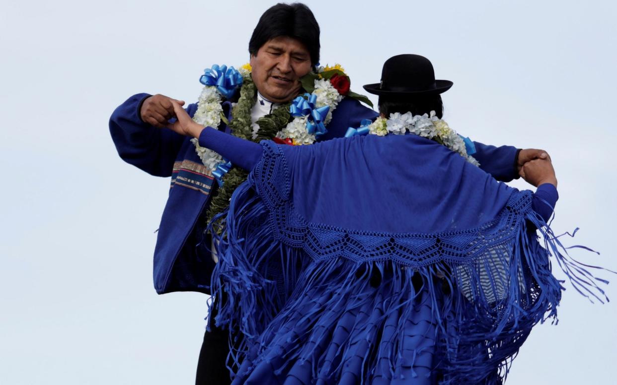 Bolivia's President dances during a closing campaign rally in El Alto - REUTERS
