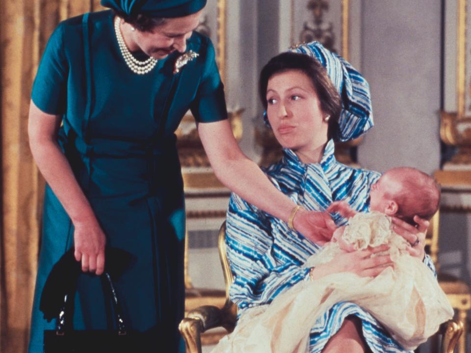 Queen Elizabeth II with her daughter, Princess Anne and grandson, Peter Phillips at his christening on December 12, 1977.