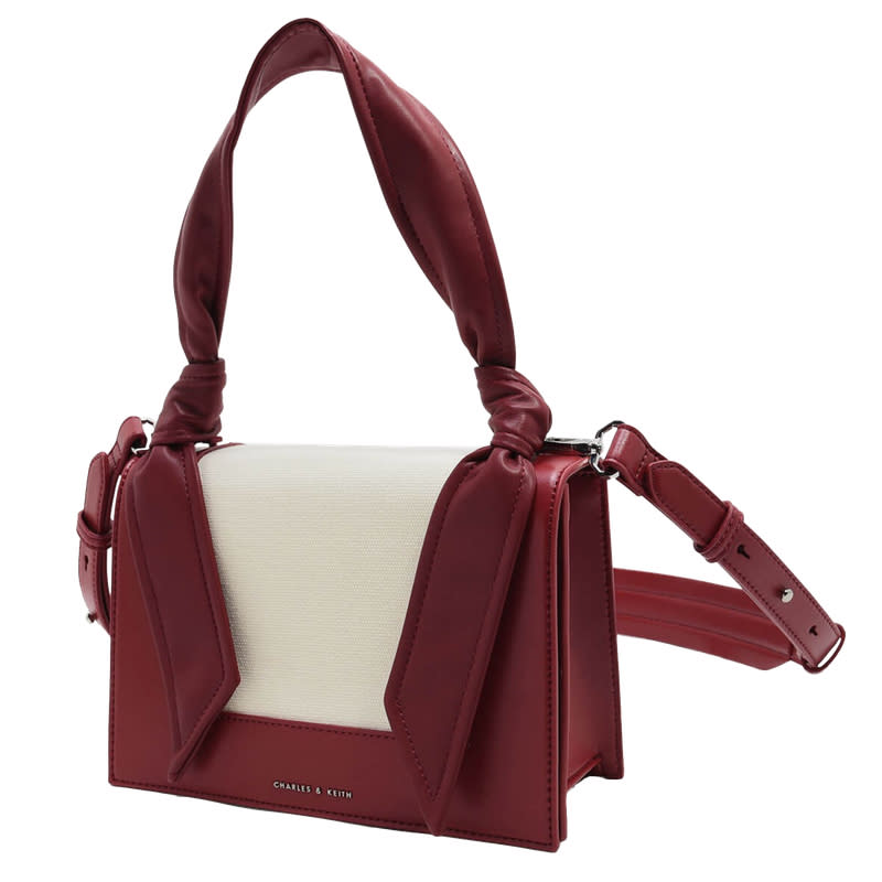 <a rel="nofollow noopener" href="http://www.charleskeith.com/us/bags/knoted-strap-handbag-red-ck2-50780523.html" target="_blank" data-ylk="slk:Knotted Strap Handbag, Charles & Keith, $69;elm:context_link;itc:0;sec:content-canvas" class="link ">Knotted Strap Handbag, Charles & Keith, $69</a>