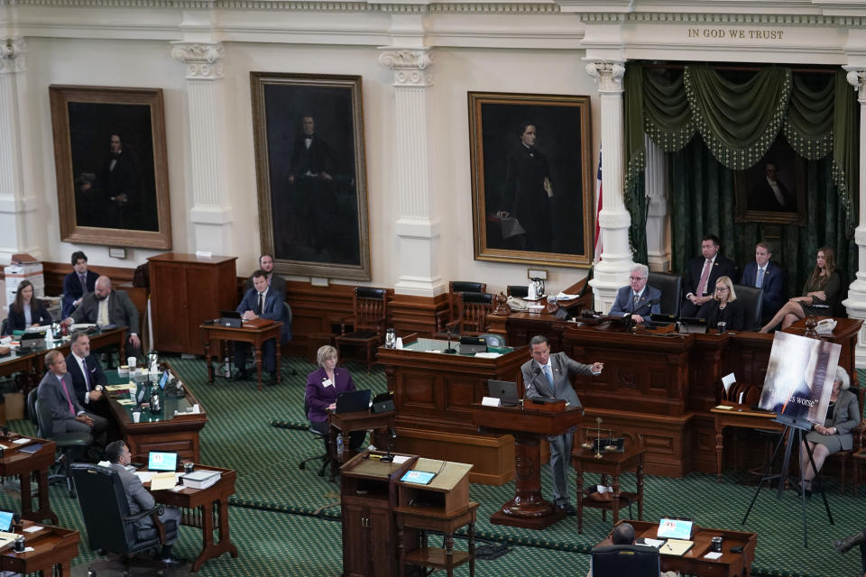 Defense attorney Tony Buzbee, standing a podium, makes closing arguments during the impeachment trial for suspended Texas Attorney General Ken Paxton in the Senate Chamber at the Texas Capitol, Friday, Sept. 15, 2023, in Austin, Texas. (AP Photo/Eric Gay)