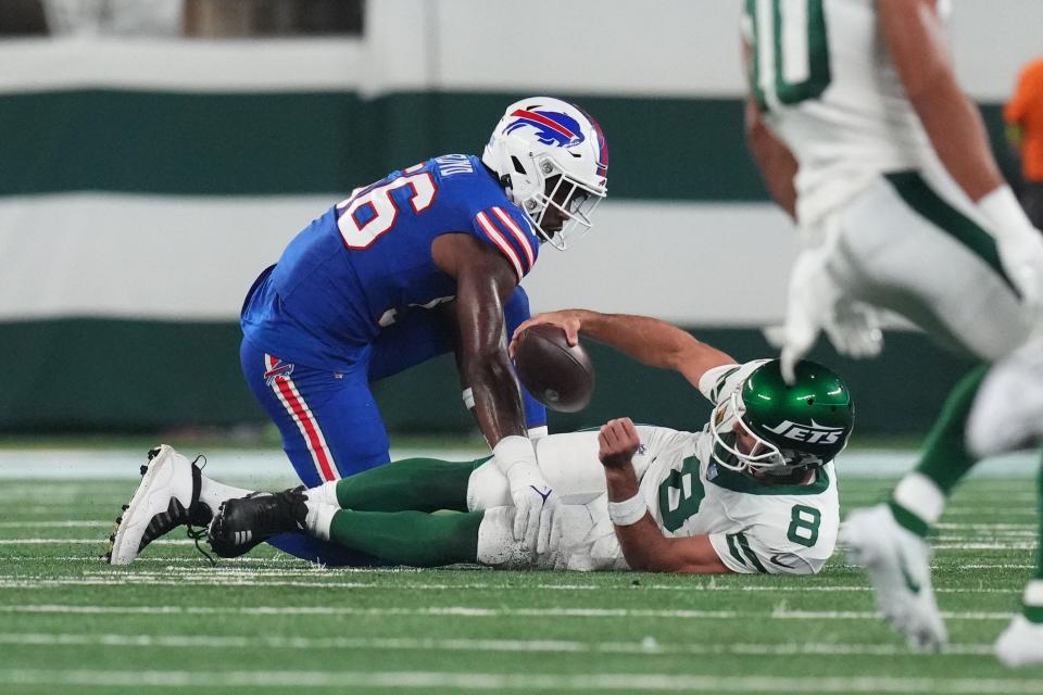 Buffalo Bills defensive end Leonard Floyd (56) sacks New York Jets quarterback Aaron Rodgers (8) early in the first quarter during the home opener at MetLife Stadium on Monday, Sept. 11, 2023, in East Rutherford. Rodgers was carted off the field after being hit.