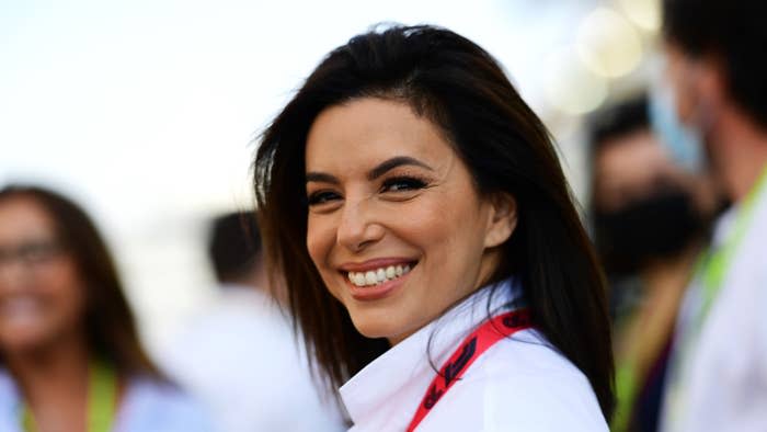 Longoria smiles over her shoulder at an event