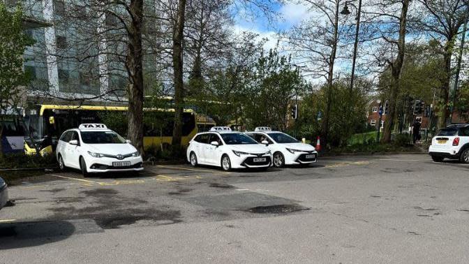 Taxis at a car park in Oldham