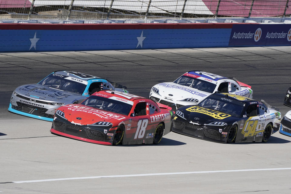 Daniel Hemric (18) drives along with John H. Nemechek (54), Sam Mayer (8) and Brandon Jones (19) during a NASCAR Xfinity Series auto race at Texas Motor Speedway Saturday, Oct. 16, 2021, in Fort Worth, Texas. (AP Photo/Larry Papke)