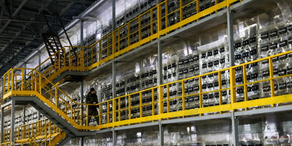 Security guard Viktor Kudinov patrols a server room of the BitRiver data centre in Bratsk, 460km north of Irkutsk.