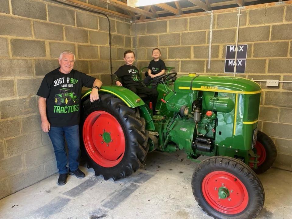 Darlington and Stockton Times: Bill Moody and his grandsons Max and Joseph on board the Deutz FL14