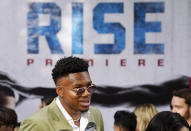 NBA basketball player Giannis Antetokounmpo is interviewed on the red carpet at the premiere of the Disney+ film "Rise," Wednesday, June 22, 2022, at Walt Disney Studios in Burbank, Calif. The film is based on the story of Antetokounmpo and his family, who emigrated from Nigeria to Greece before Giannis and two of his brothers found success in the National Basketball Association. (AP Photo/Chris Pizzello)