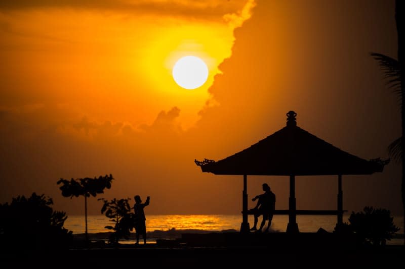 Bali beach sunsets like this now cost 150,000 Indonesian rupiah more (about $9) following the launch of the Indonesian holiday island's new tourist tax. Christoph Soeder/dpa
