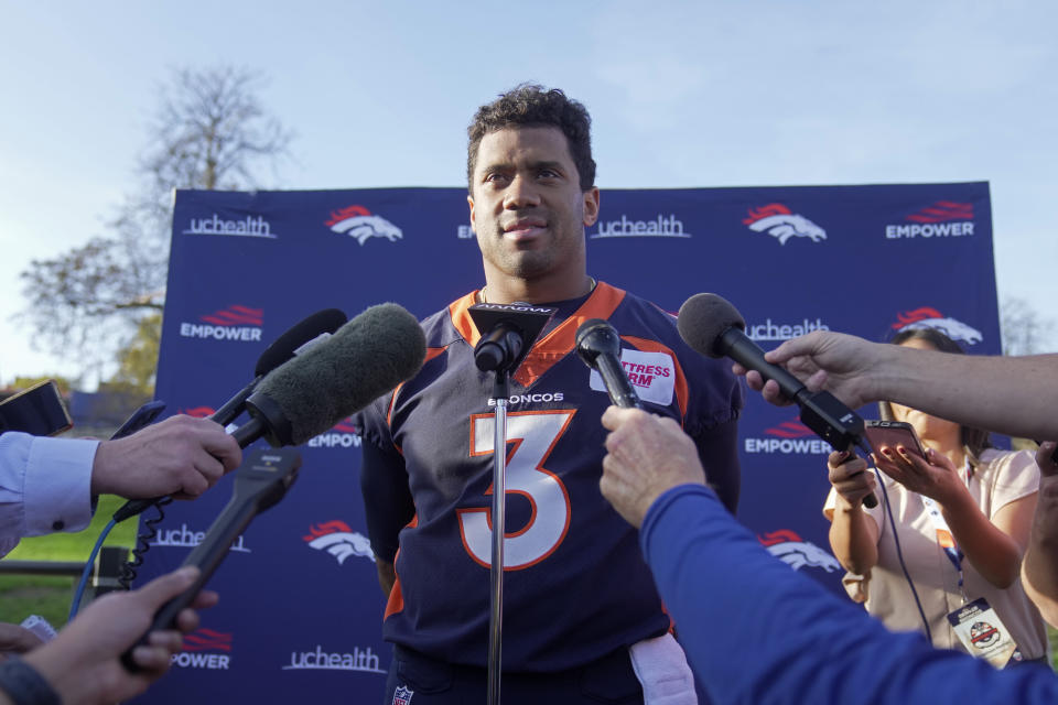 Denver Broncos quarterback Russell Wilson speaks at a news conference after a practice session in Harrow, England, Wednesday, Oct. 26, 2022 ahead the NFL game against Jacksonville Jaguars at the Wembley stadium on Sunday. (AP Photo/Kin Cheung)