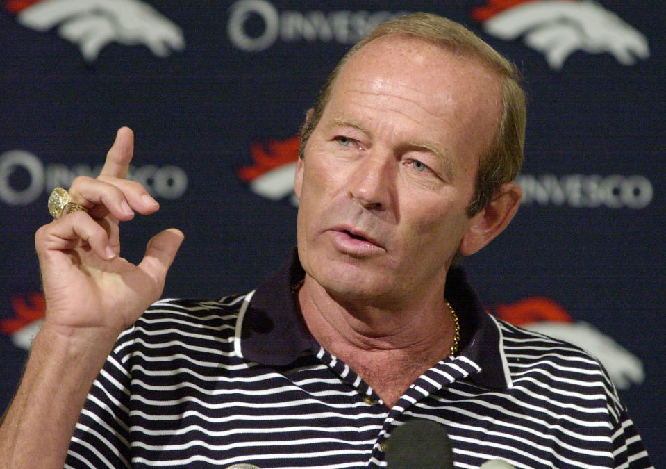 FILE - In this Aug. 20, 2002, file photo, Denver Broncos owner Pat Bowlen gestures during a news conference at the team's headquarters in Denver. Pat Bowlen, the Denver Broncos owner who transformed the team from also-rans into NFL champions and helped the league usher in billion-dollar television deals, died late Thursday night, June 13, 2019, just under two months before his enshrinement in the Pro Football Hall of Fame. He was 75. In a statement posted on the Broncos' website, Bowlen's family said he died peacefully at home surrounded by loved ones. (AP Photo/Ed Andrieski, File)