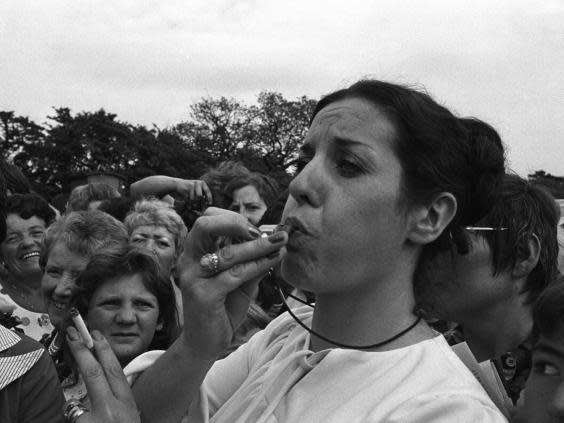 Williams blows a whistle for peace at a Belfast rally in 1976 (Getty)