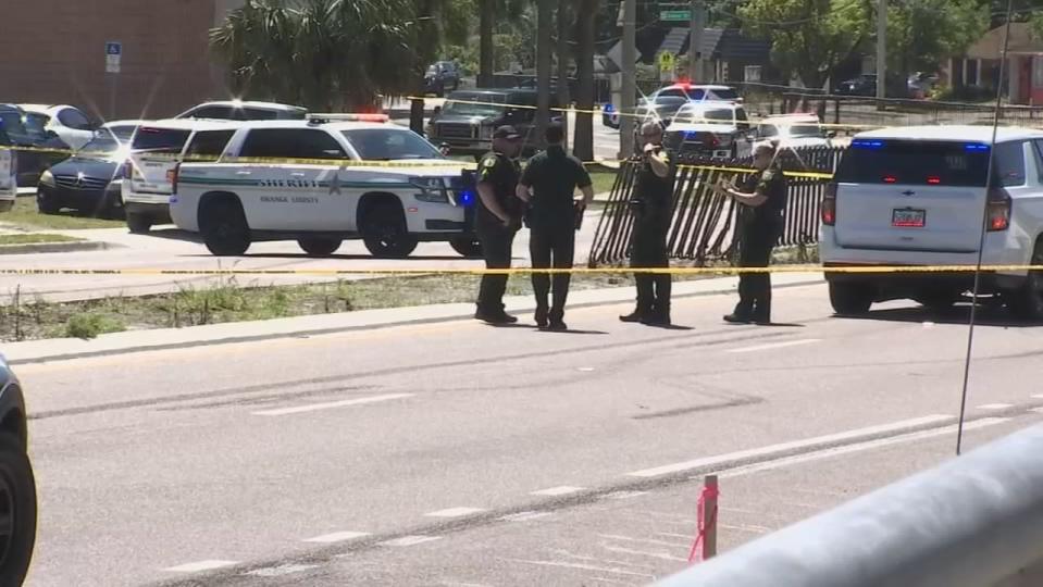 A deputy shot at two armed men during a traffic stop Friday morning in the Pine Hills neighborhood, Orange County Sheriff John Mina said.