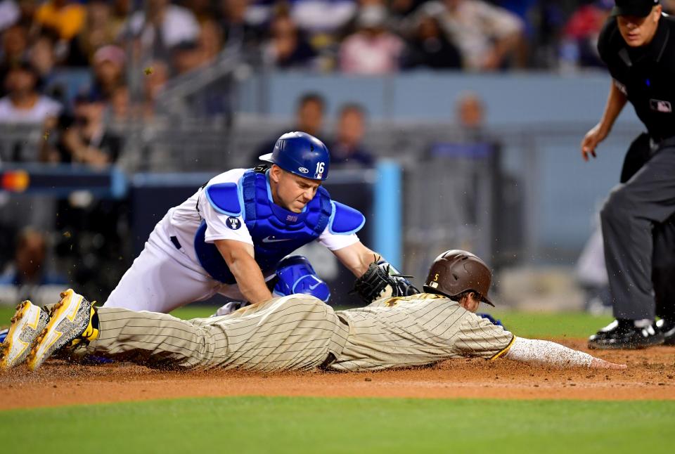 Dodgers catcher Will Smith tags out Padres right fielder Wil Myers at the plate in Game 2.