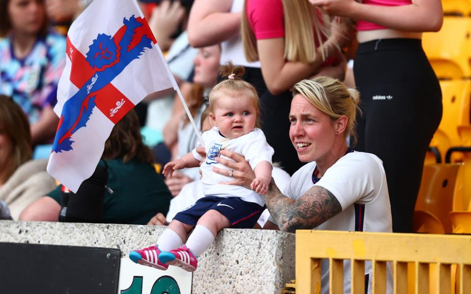 A young England fan with their family looks on prior to kick off - Naomi Baker/Getty Images