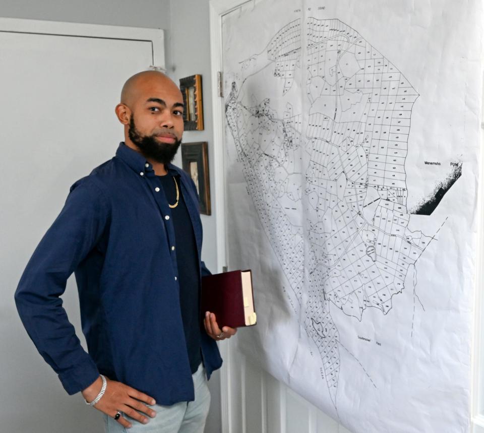 SAGAMORE  10/12/22 Troy Small with a map of Aquinnah showing parcels in the land case.