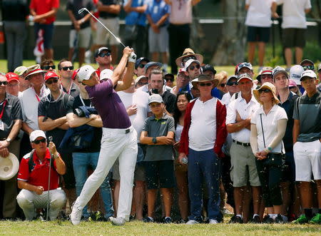 Jordan Spieth of the U.S. plays an iron shot down the fairway during the final round of the 2015 Emirates Australian Open Golf in Sydney, Australia, November 29, 2015. REUTERS/Steve Christo