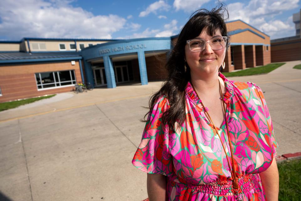 Mari Butler Abry, the district librarian for Perry Community Schools, stands for a photo Wednesday, May 22, 2024, outside Perry High School.