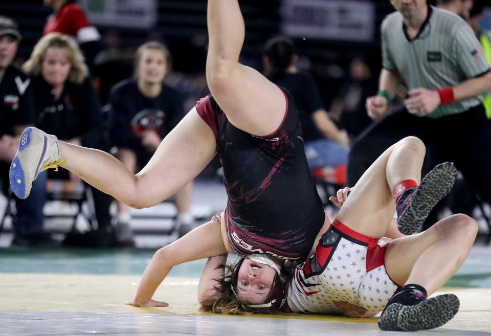 South Kitsap’s Monica Kaiser takes first place over Yelm’s Camryn Erickson in their 145-pound championship during Mat Classic Championships at the Tacoma Dome on Saturday, Feb. 18, 2023. 