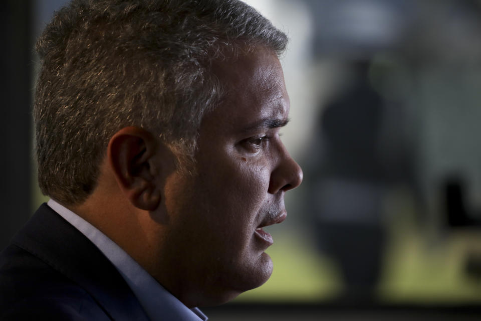 Colombia's President Ivan Duque speaks during an interview with The Associated Press at the CATAM air base in Bogota, Colombia, Saturday, Sept. 21, 2019. Duque's will speak before the United Nations General Assembly and is expected to condemn Venezuelan leader Nicolás Maduro as an abusive autocrat who is not only responsible for the country's humanitarian catastrophe but is also now a threat to regional stability for his alleged harboring of Colombian rebels labeled a terrorist group by the U.S. and European Union. (AP Photo/Ivan Valencia)