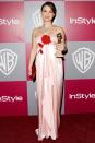 <p>Natalie Portman (due any day with her first child) <a href="https://www.youtube.com/watch?v=xLVUwSZtJMs" rel="nofollow noopener" target="_blank" data-ylk="slk:memorably took home her award;elm:context_link;itc:0;sec:content-canvas" class="link ">memorably took home her award</a> for her dark turn in<em> Black Swan</em> in a romantic Viktor & Rolf gown .</p>