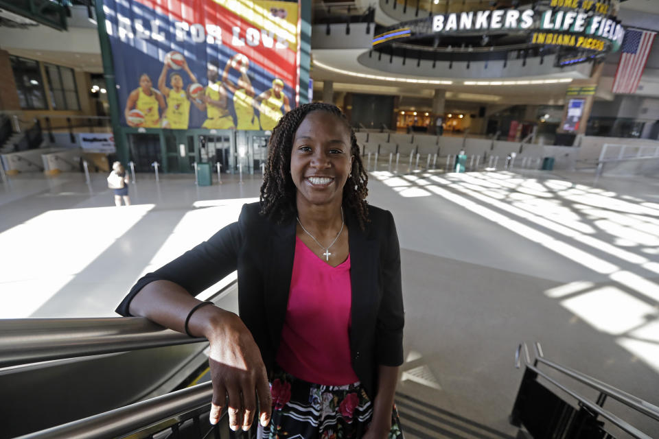 FILE - In this June 26, 2019 file photo, Tamika Catchings poses for a photo inside Banker's Life Fieldhouse in Indianapolis. Catchings is part of a nine-person group announced Saturday, April 4, 2020, as this year’s class of enshrinees into the Naismith Memorial Basketball Hall of Fame. (AP Photo/Darron Cummings, File)