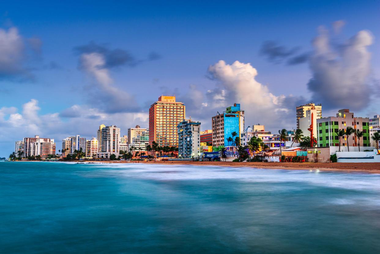 San Juan, Puerto Rico resort skyline on Condado Beach on dusk.