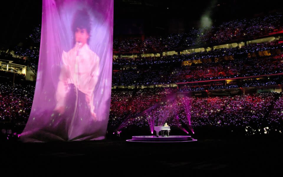 Justin sat at the piano while a sheet projected an image of Prince in the background. Photo: NBC