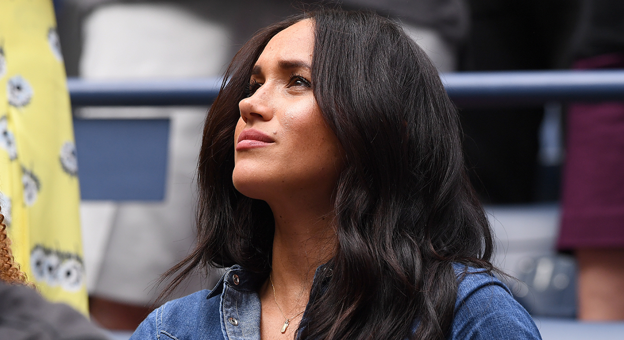 Meghan Markle wore two gold tags, one with a 'H' and another with a 'A' at the US Open [Photo: Getty Images]