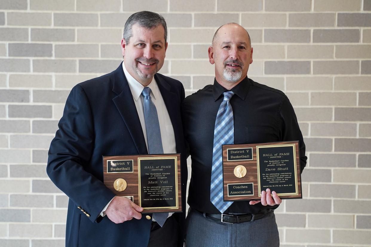 Matt Voll and Dave Shutt pose with their Hall of Fame plaques.