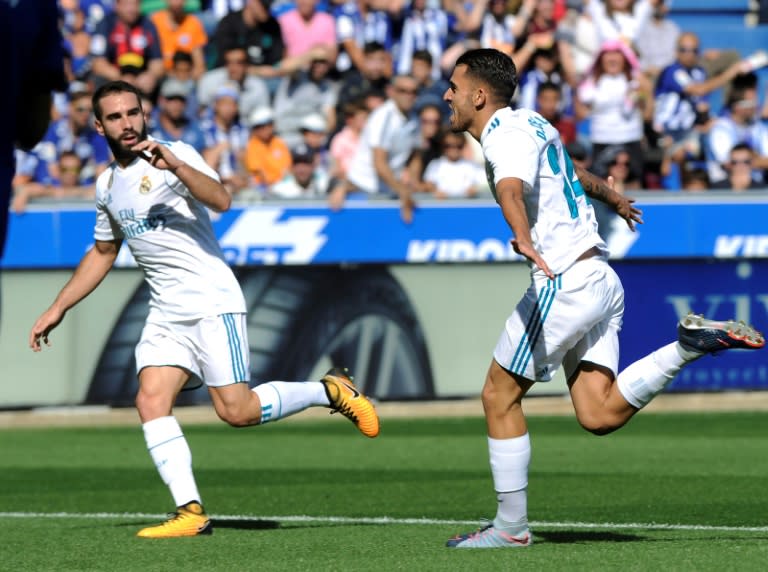 Real Madrid's midfielder Daniel Ceballos (R) celebrates after scoring his team's first goal beside Real Madrid's defender Dani Carvajal during the Spanish league football match against Deportivo Alaves September 23, 2017