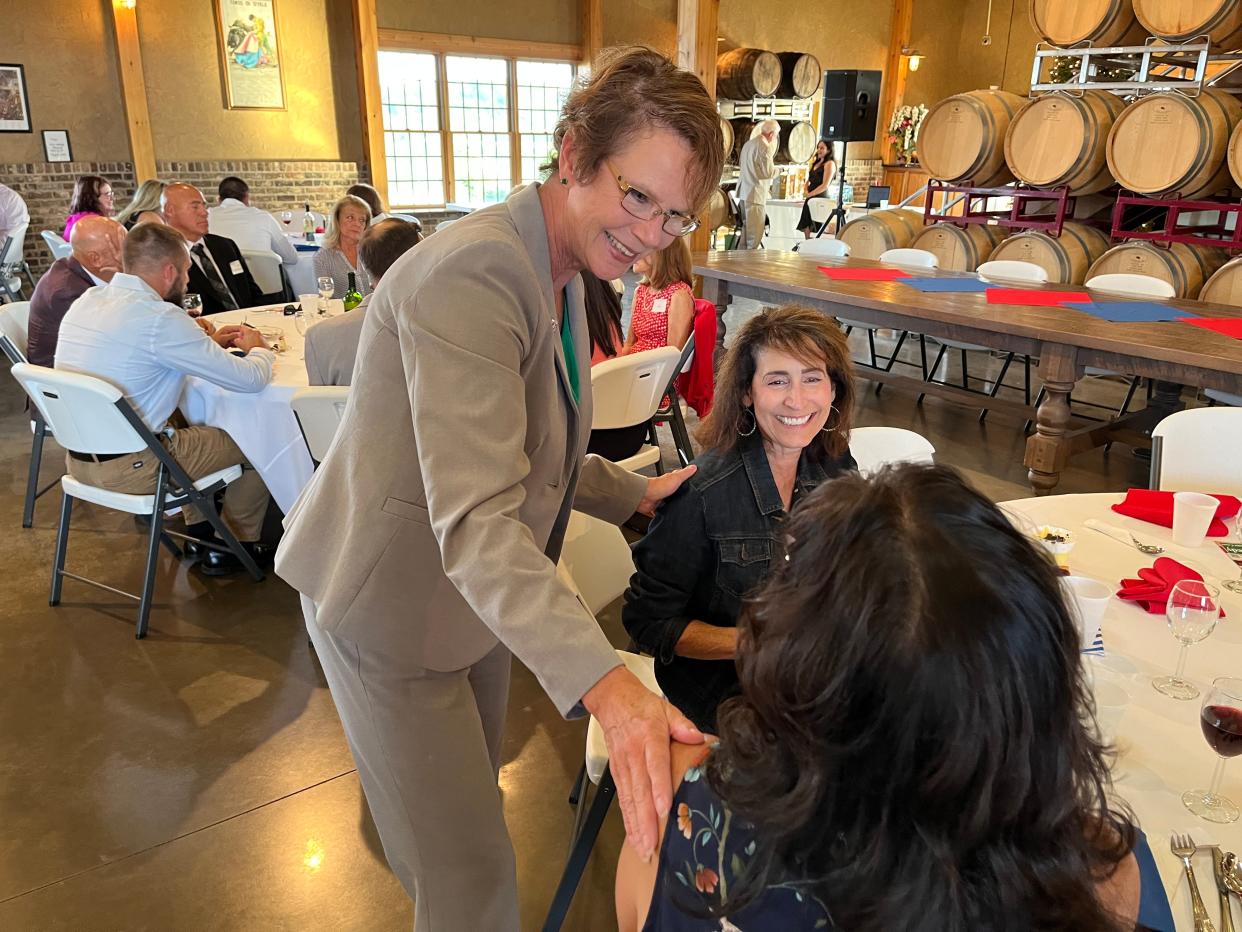 Ohio Supreme Court Justice Sharon Kennedy greets people attending a fundraiser for her campaign for chief justice during an event Wednesday at the Toolshed at Breitenbach Vineyards near Dover.