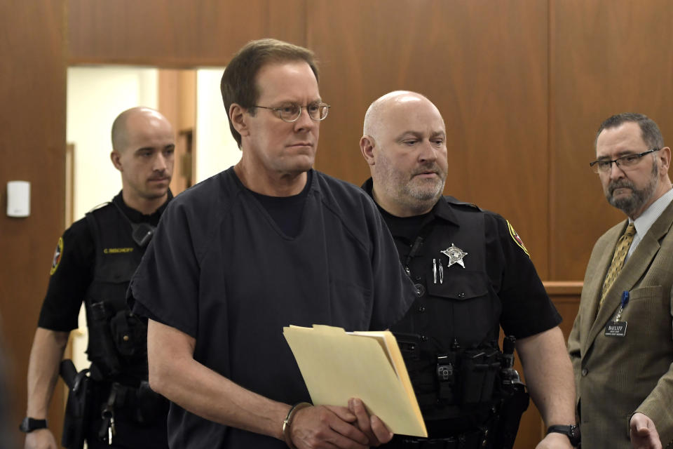 Mark Jensen makes his way into the courtroom for his sentencing hearing, Friday, April 14, 2023, in Kenosha, Wis. The Wisconsin Supreme Court ruled in 2021 that Jensen deserved a new trial in the 1998 death of his wife Julie Jensen, who was poisoned with antifreeze. (Sean Krajacic/The Kenosha News via AP, Pool)