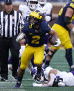 Michigan running back Blake Corum rushes during the second half of an NCAA college football game against Northwestern, Saturday, Oct. 23, 2021, in Ann Arbor, Mich. (AP Photo/Carlos Osorio)