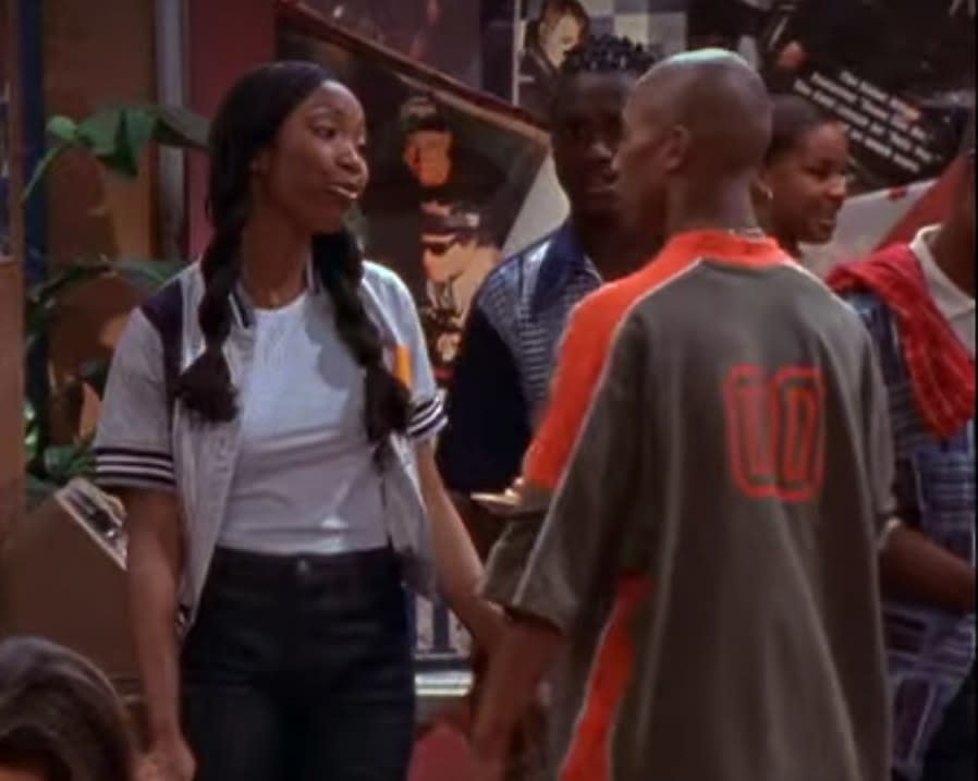 Moesha jersey-style shirt over a t-shirt and jeans