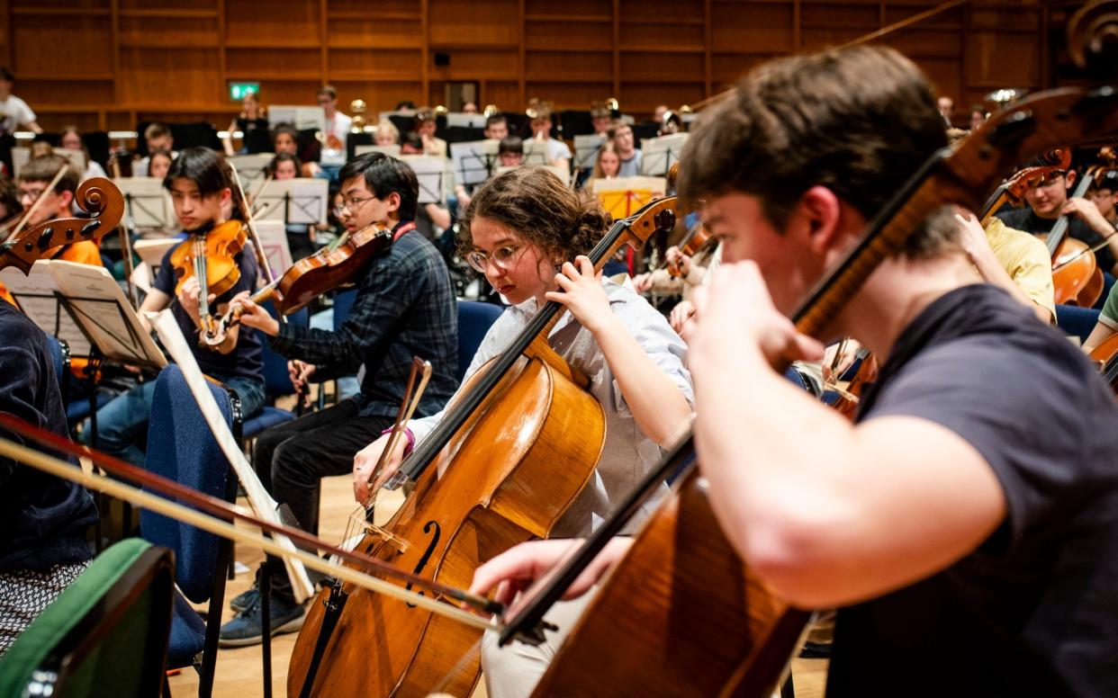 The National Youth Orchestra, consisting of 167 young musicians aged 13-19, rehearse together for the first time since January 2020 at The Gulbenkian Arts Centre in Canterbury, in April 2022 - John Nguyen/JNVisuals