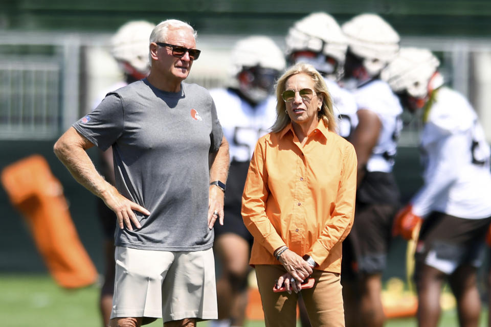 FILE - Cleveland Browns owners Jimmy, left, and Dee Haslam look on during the NFL football team&#39;s training camp, on July 28, 2022, in Berea, Ohio. Browns owners Dee and Jimmy Haslam are in talks to buy a minority stake in the NBA&#39;s Milwaukee Bucks, a person familiar with the negotiations told the Associated Press on Friday, Feb. 10, 2023. The Haslams, who have explored interest in buying other pro teams in the past, are interested in the 25% share currently held by Marc Lasry, said the person who spoke on condition of anonymity because of the sensitivity of the situation. (AP Photo/Nick Cammett, File)