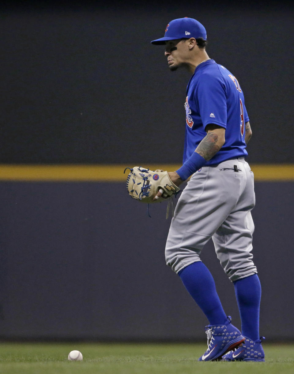 Chicago Cubs' Javier Baez reacts after committing an error during the fourth inning of a baseball game against the Milwaukee Brewers on Tuesday, Sept. 4, 2018, in Milwaukee. (AP Photo/Aaron Gash)