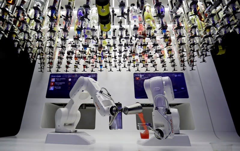 FILE PHOTO: A robotic bartender prepares drinks in Karlovy Lazne Music Club in Prague