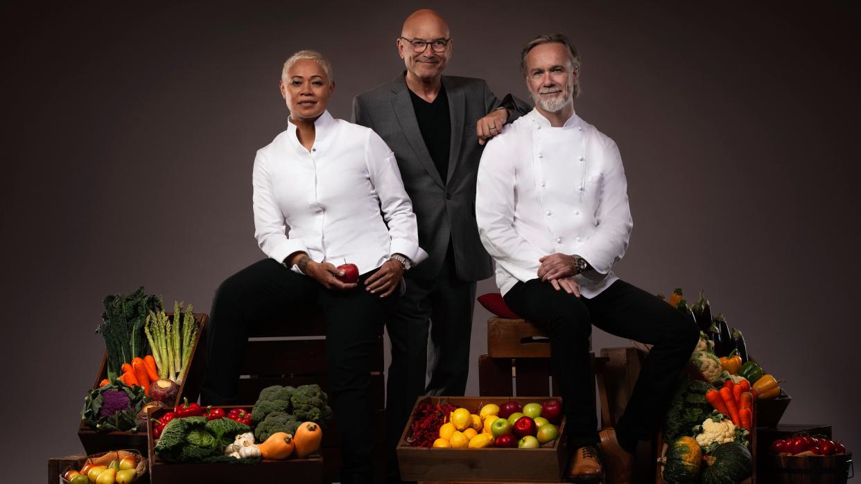  MasterChef: The Professionals 2023 judges Monica Galetti, Gregg Wallace and Marcus Wareing (L-R) surrounded by boxes of fresh ingredients. 