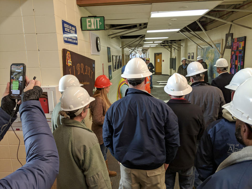 Government officials, including Sen. Lisa Murkowski and Sen. Dan Sullivan, tour earthquake-damaged Houston Middle School on Dec. 8, 2018. The school was so damaged from the magnitude 7.1 earthquake that struck on Nov. 30, 2018, that it had to be demolished and replaced. (Photo by Balinda O’Neal Dresel/U.S. Army National Guard)