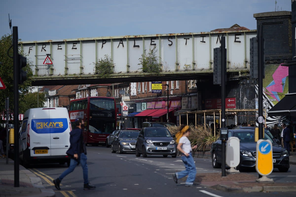 Pro Palestinian graffiti was sprayed on a railway bridge in Golders Green, north London, an area with a prominent Jewish population (PA Wire)