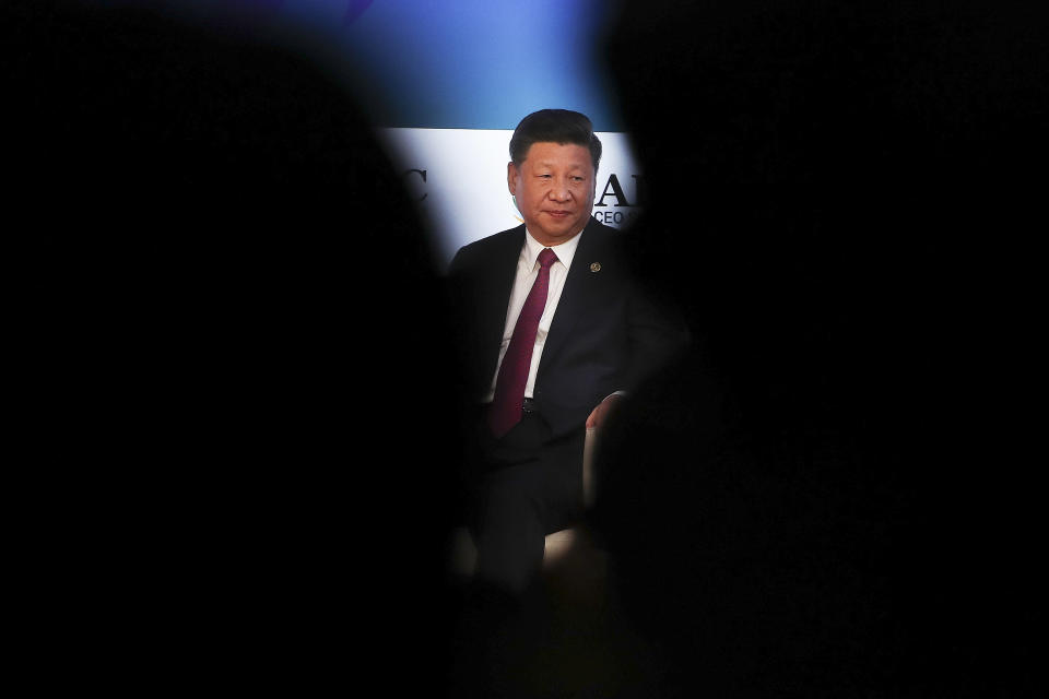 China's President Xi Jinping sits before giving his speech at the APEC CEO Summit 2018 in Port Moresby, Papua New Guinea, Saturday, Nov. 17, 2018. (Fazry Ismail/Pool Photo via AP)