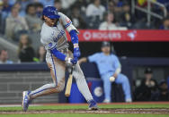 Kansas City Royals' Bobby Witt Jr. (7) hits an RBI double against the Toronto Blue Jays during the eighth inning of a baseball game, Tuesday, April 30, 2024 in Toronto.(Nathan Denette/The Canadian Press via AP)